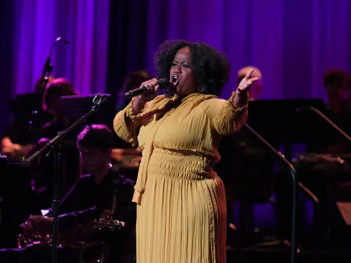 A singing performance on stage.