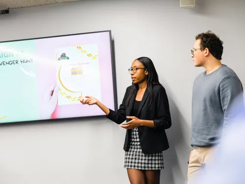 Students present client pitches. 