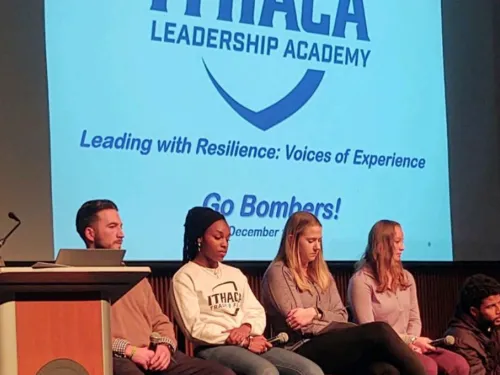 Students sitting on stage