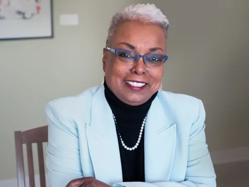 woman with glasses sitting