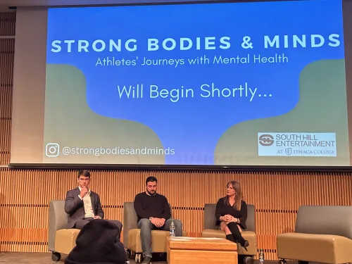 Panelists on a stage