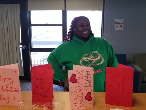 Student in front of cards