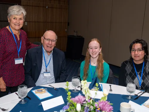 Carrie and Art Ostrander with students