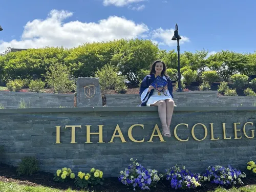 woman sitting on a wall