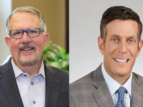 man wearing glasses next to man wearing a tie