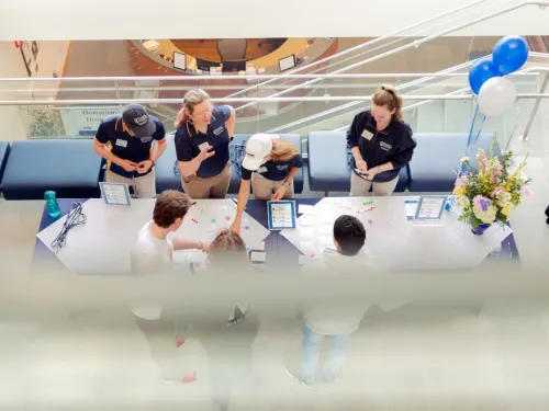 Bird's eye view looking down at open house registration table 