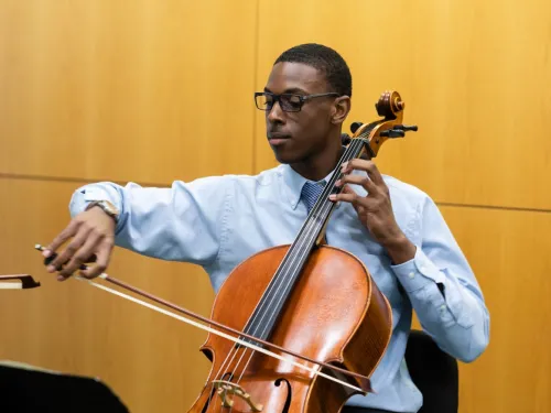 person playing a cello