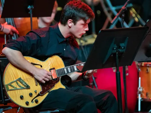 person playing a guitar