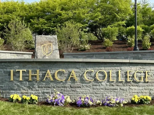 stone wall with Ithaca College on it