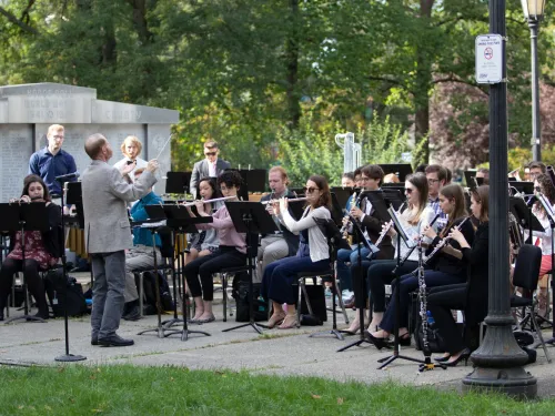 Musicians performing in a park.