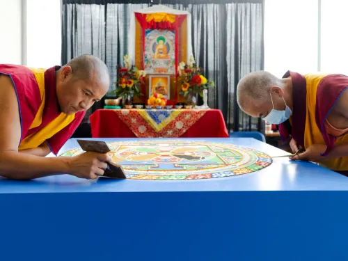 Tibetan monks creating a sand mandala