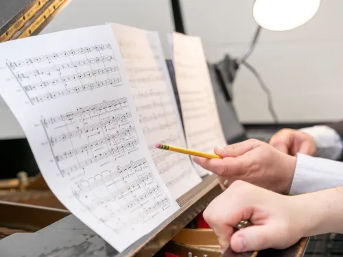 student reading sheet music