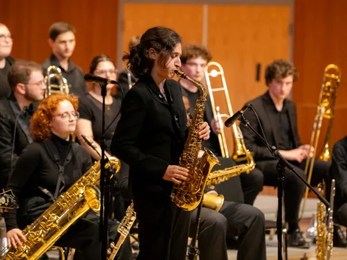 student playing in an ensemble