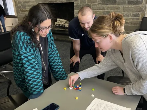 Leadership Scholars doing a team activity with legos