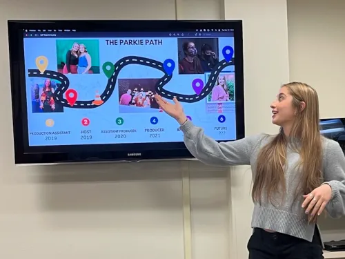 Student presenting a PowerPoint