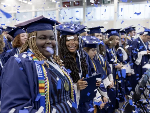 Students smiling at Commencement