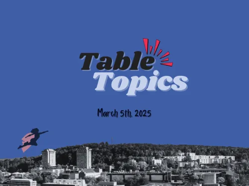 Table Topics logo with superhero flying over IC skyline