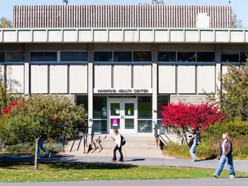students walking in front of the Hammond Health Center building 