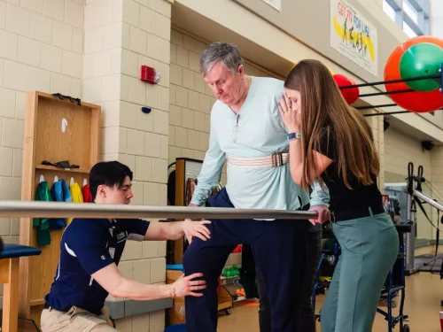 PT students work with an elderly patient in the on campus clinic 
