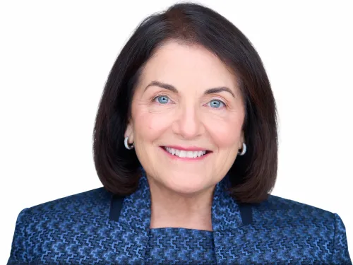 dark-haired woman wearing blue