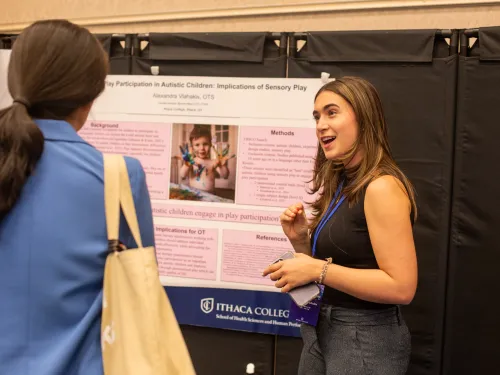 Student presenting at Whlaen