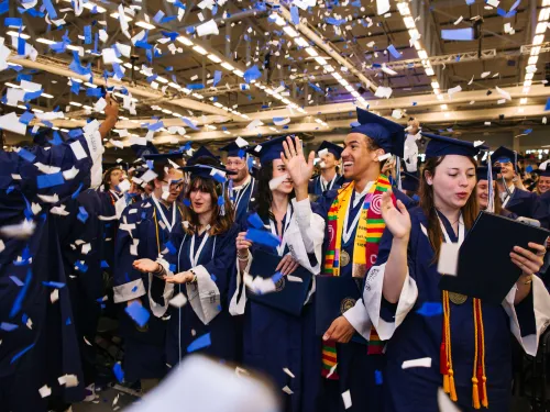 Graduates celebrate with confetti