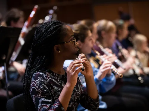 Student playing in a orchestra