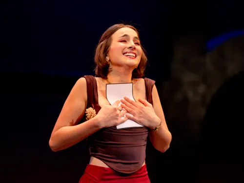 Actress clutches a letter