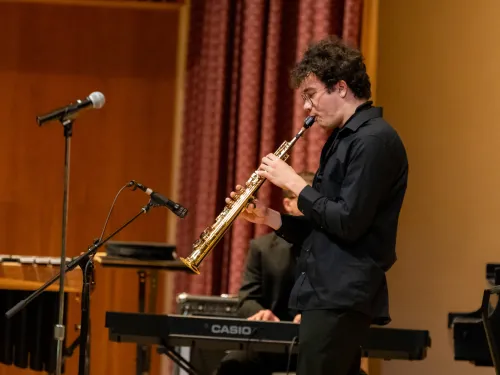 student playing in an ensemble