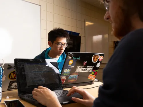 Students working together on their computers.