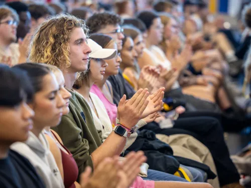 College students listen to a speaker.