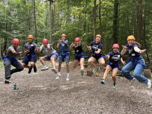 Group of students jumping in the air.