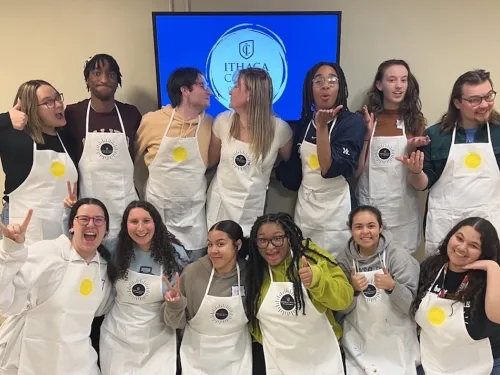 Student leaders posing with aprons on