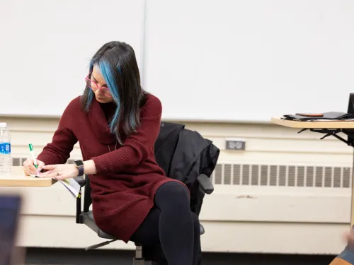 Professor taking notes