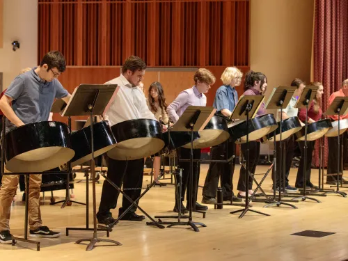 Student playing timpani