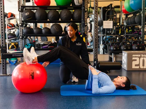 Member working with Wellness Clinic Staff on form