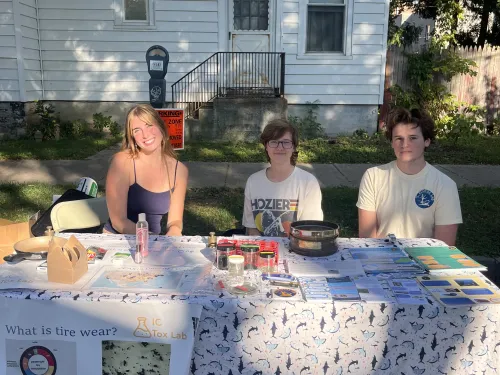 EcoTox Lab members Samantha Funk, Elliot House-Kelly, and Charlie Stearns tabling at the festival.