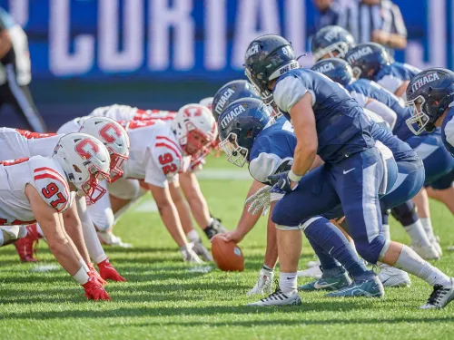 Football players square off. 