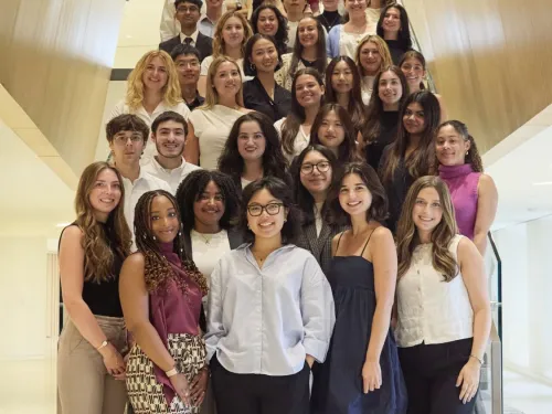 Student Interns posing on staircase