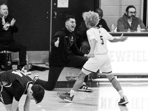 Mendel high five on sideline