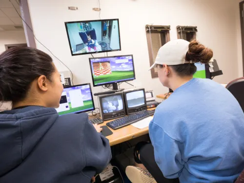 Students looking at research systems, participating in Tots on Bots program.