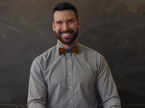 Bearded man wearing a bow tie.
