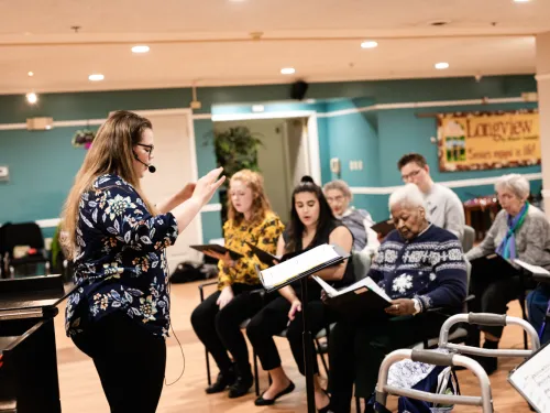 grad student teaching the intergenerational choir
