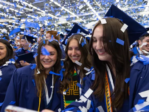 Confetti in the air at Commencement.
