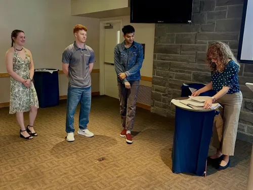 Students Keely Higgins, Zach Ritchie, and Suryash Malviya are inducted into Sigma Xi.