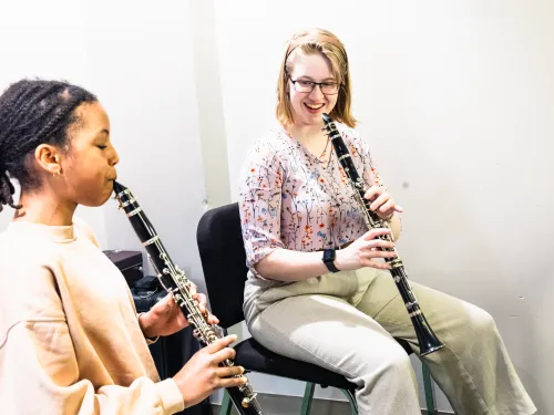 music education student works with a homeschool student