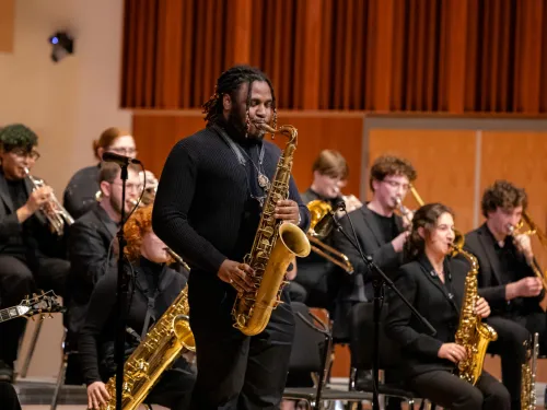 College saxophonists perform in a jazz ensemble.
