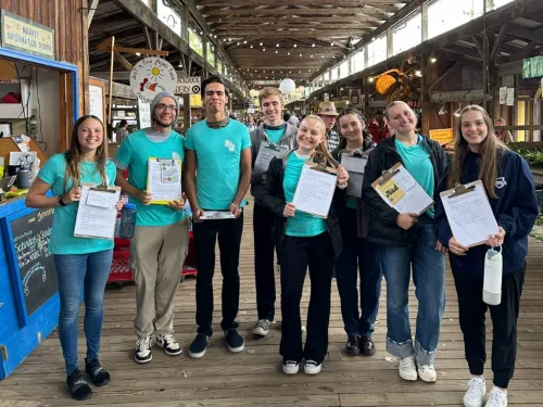 Students volunteering at the Ithaca Farmer's Market