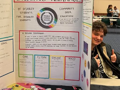 Image of student tabling for Disabled Students' Alliance.