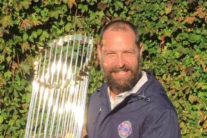 Josh Lifrak poses with World Series Commissioner's Trophy
